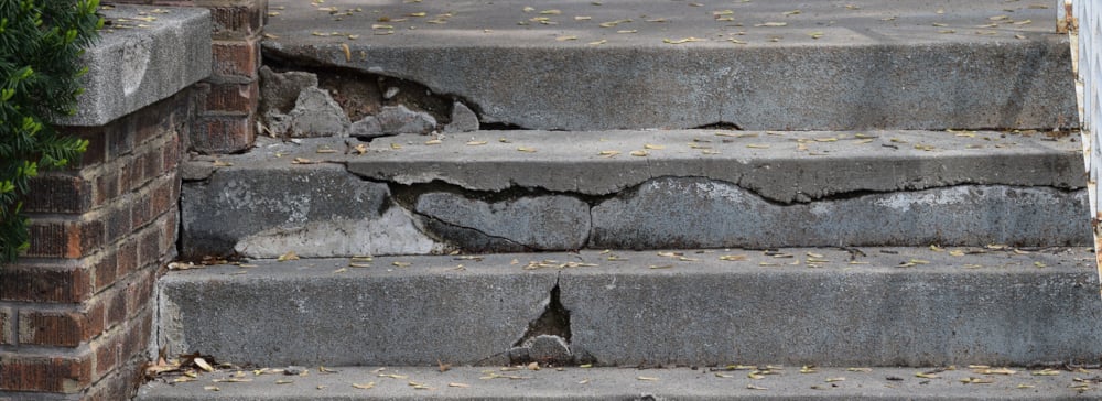 Cracked and broken cement stairs that create an opportunity for people to fall and injure themselves